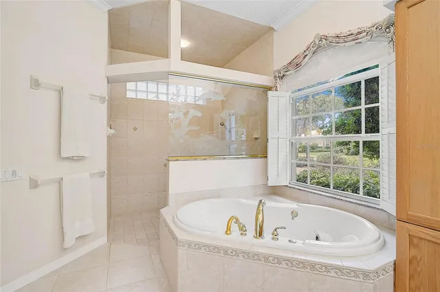 a bathroom with a granite countertop sink a mirror and a shower