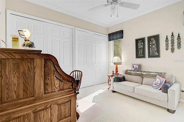 a bathroom with a granite countertop sink vanity mirror and toilet