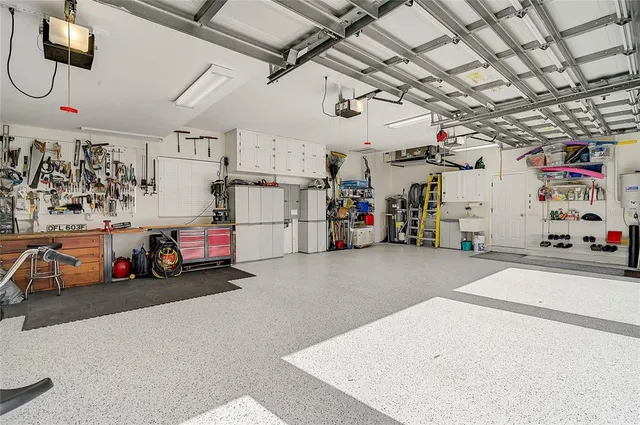 an aerial view of a house with a yard and garden