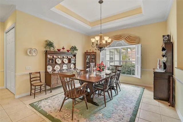 a living room with furniture and a lamp