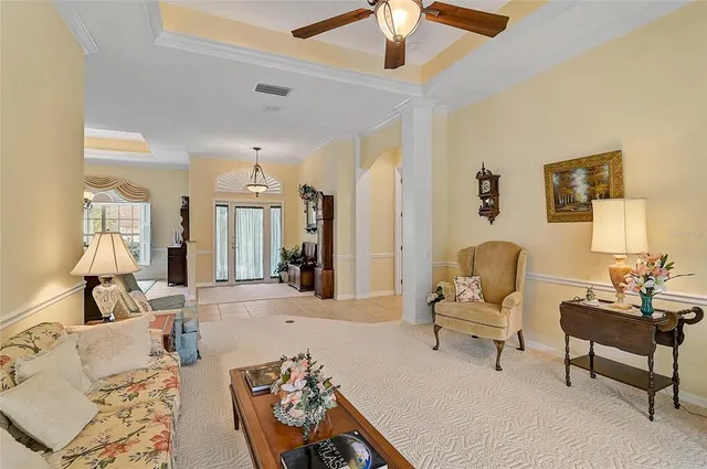 a bedroom with a bed dresser and window