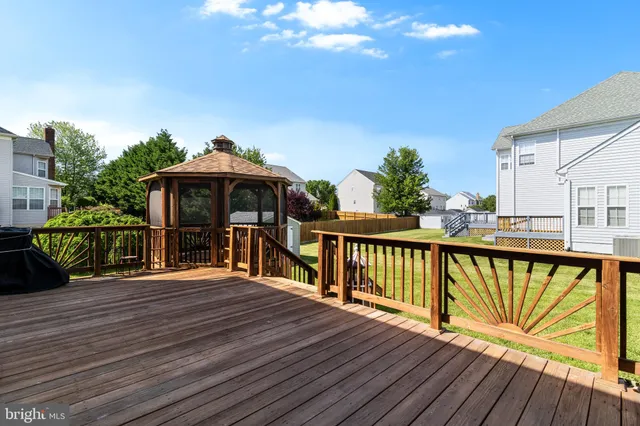 a view of a house with yard and entertaining space