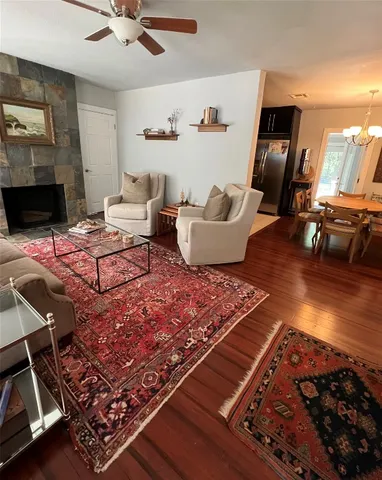 a living room with furniture rug and window