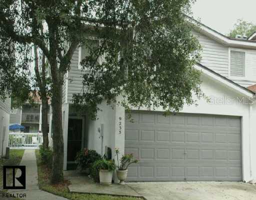 9233 Jake's Path Largo, FL 33771 - Photo 1 of 1 Exterior Front - Two car garage allows direct access into your two-story, corner end unit townhouse.