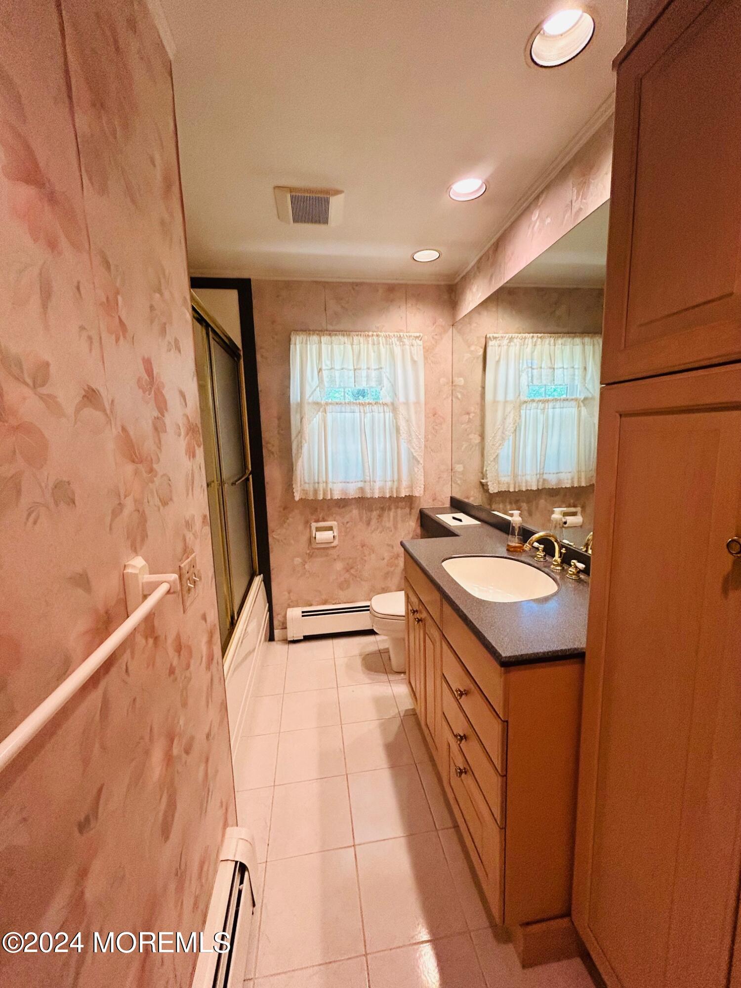 2402 Anne Terrace Wall, NJ 07719 - Photo 13 of 25 a spacious bathroom with a granite countertop sink a mirror and a shower