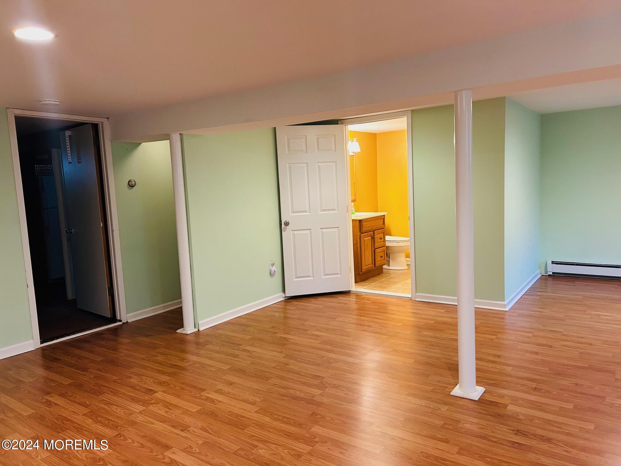 2402 Anne Terrace Wall, NJ 07719 - Photo 21 of 25 a view of empty room with wooden floor