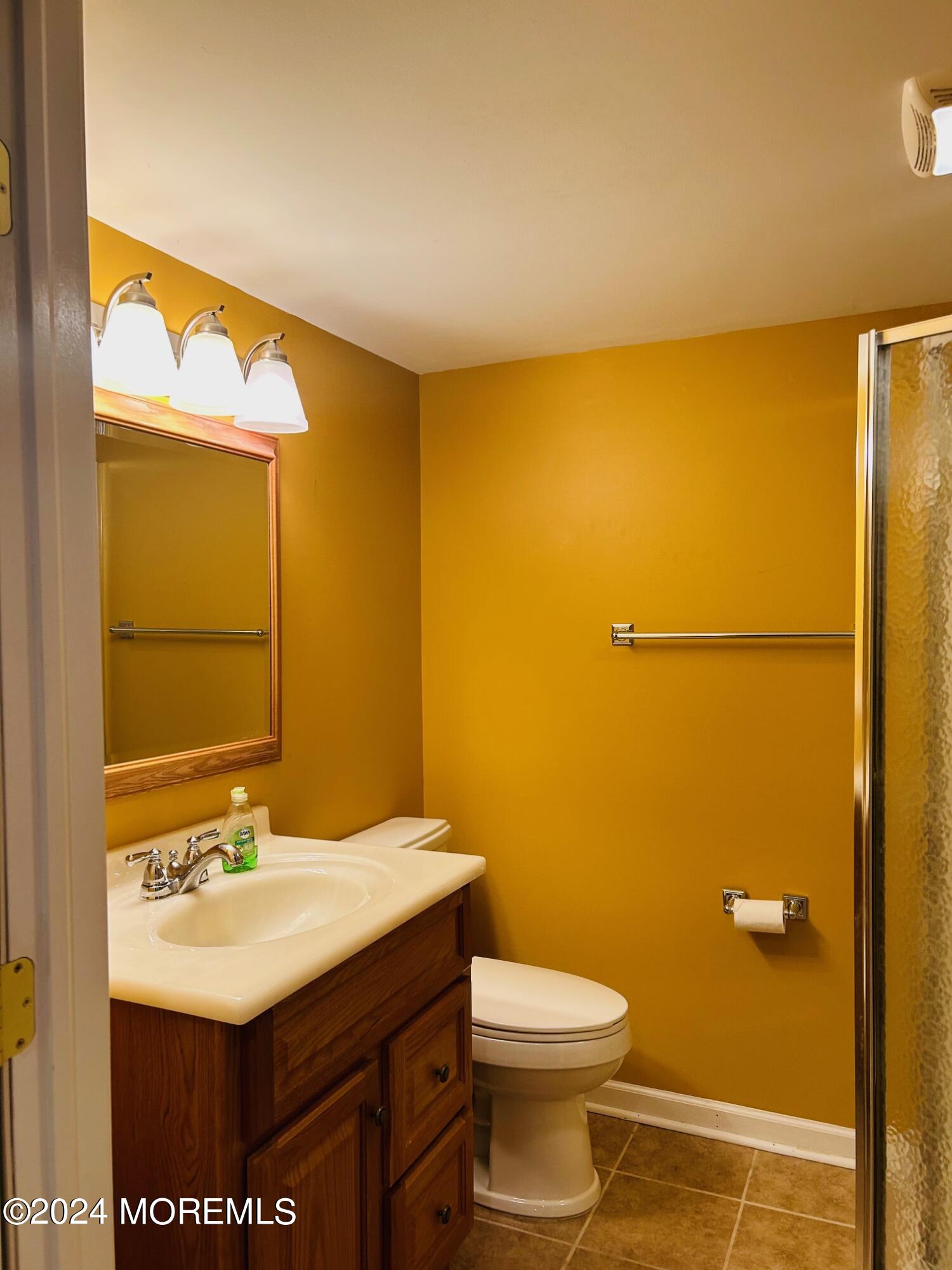 2402 Anne Terrace Wall, NJ 07719 - Photo 22 of 25 a bathroom with a sink and a mirror