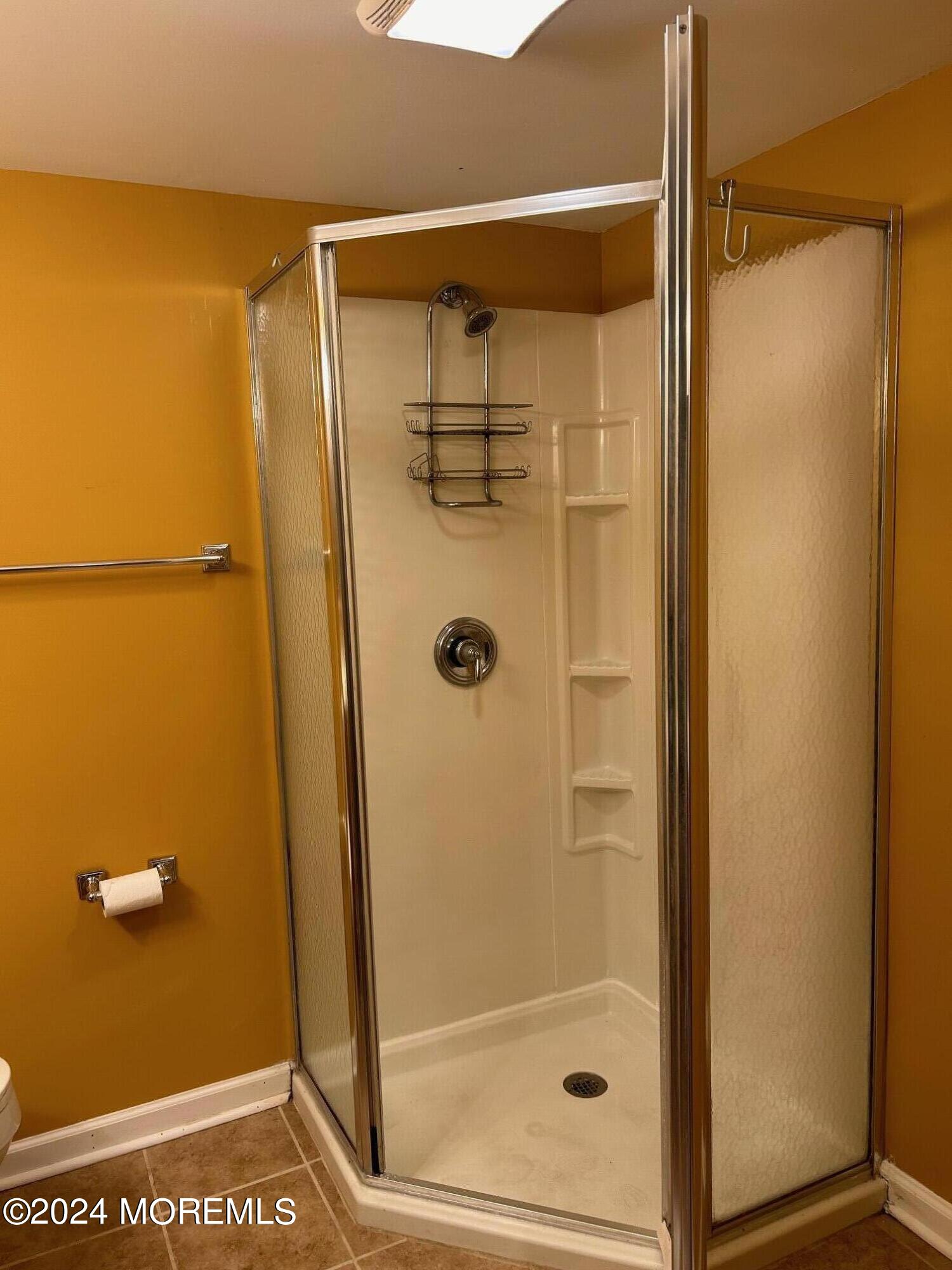 2402 Anne Terrace Wall, NJ 07719 - Photo 23 of 25 a bathroom with a glass shower door