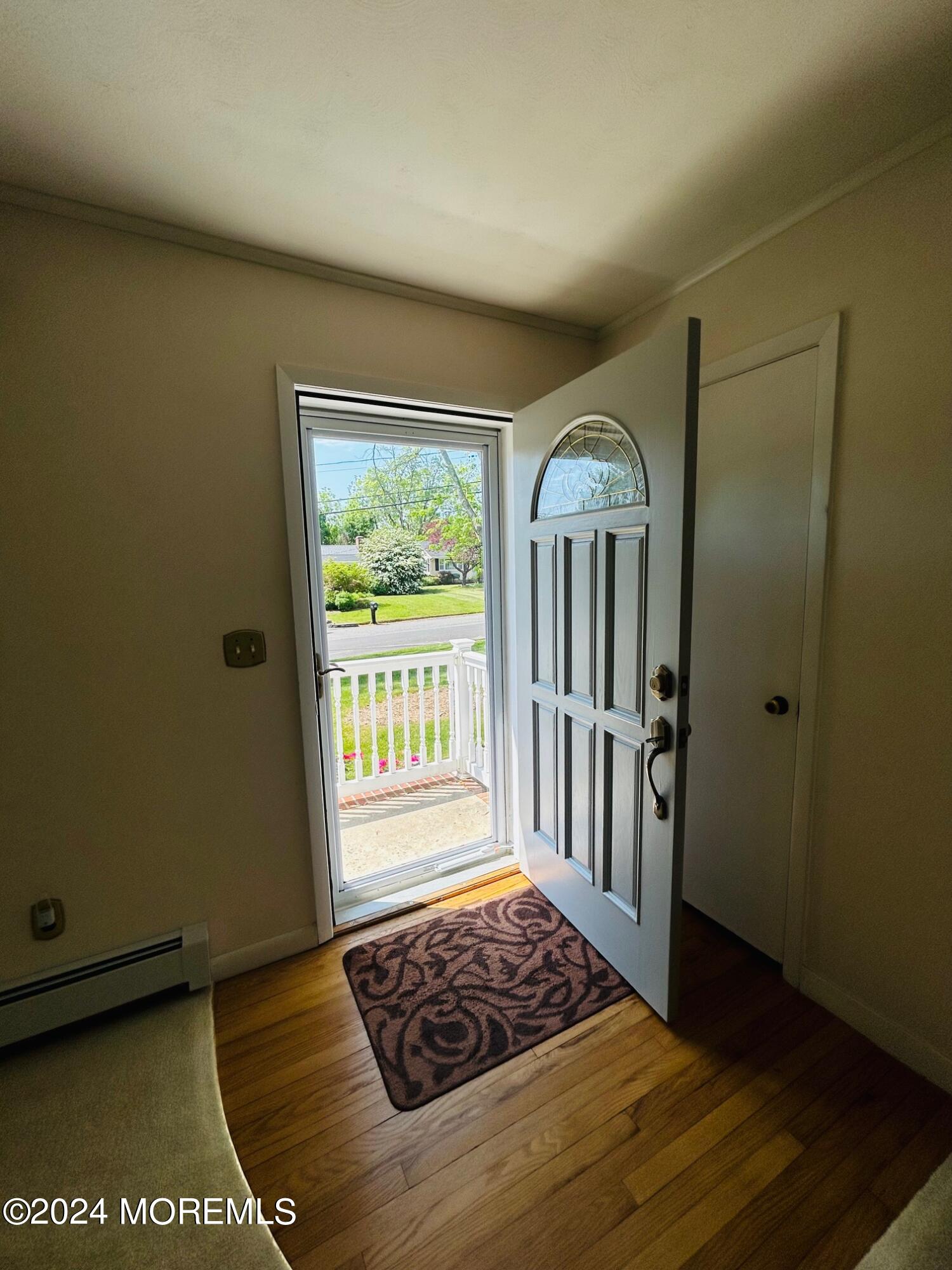 2402 Anne Terrace Wall, NJ 07719 - Photo 5 of 25 a view of a livingroom with wooden floor and a window