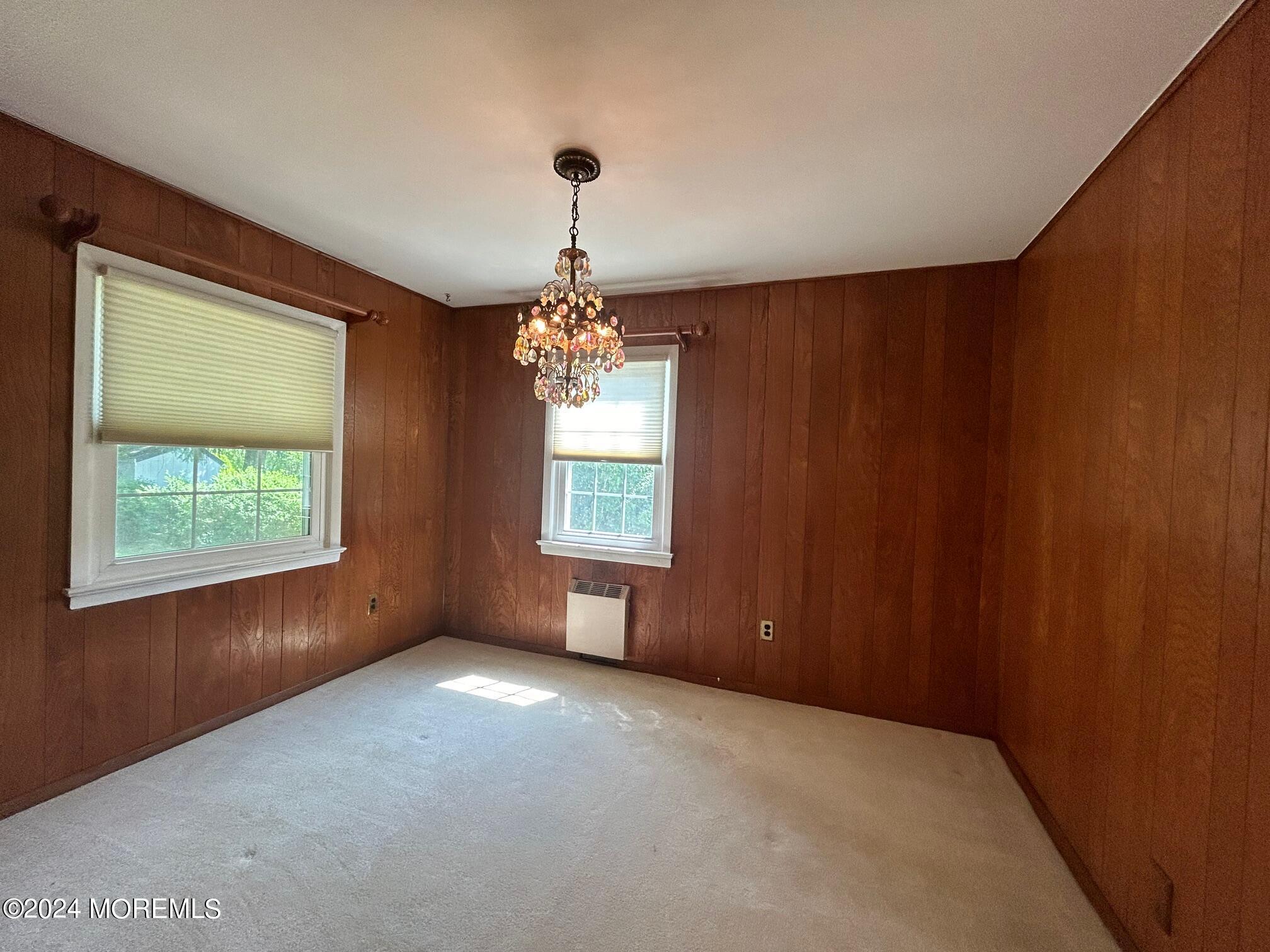 2402 Anne Terrace Wall, NJ 07719 - Photo 8 of 25 an empty room with windows and chandelier