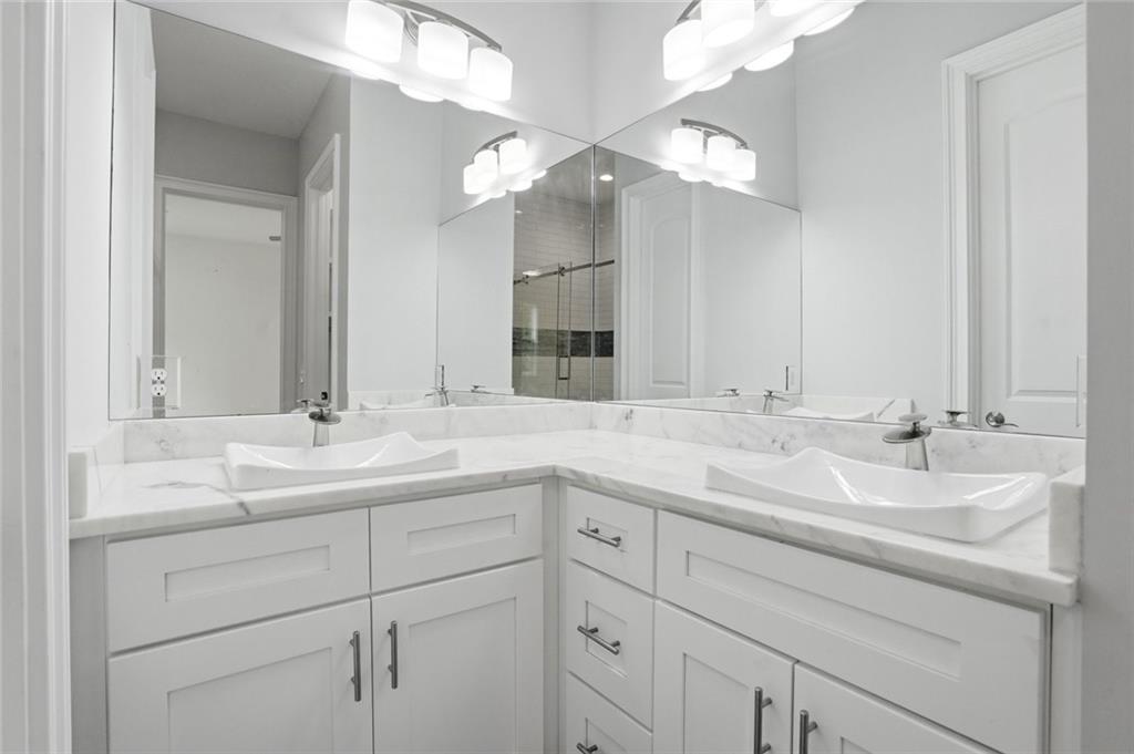 2415 West Rugby Avenue Atlanta, GA 30337 - Photo 32 of 40 a bathroom with a sink and a mirror