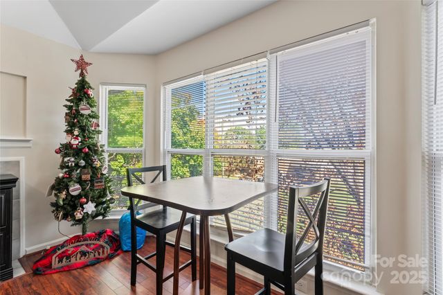 a view of a dining room with furniture and window