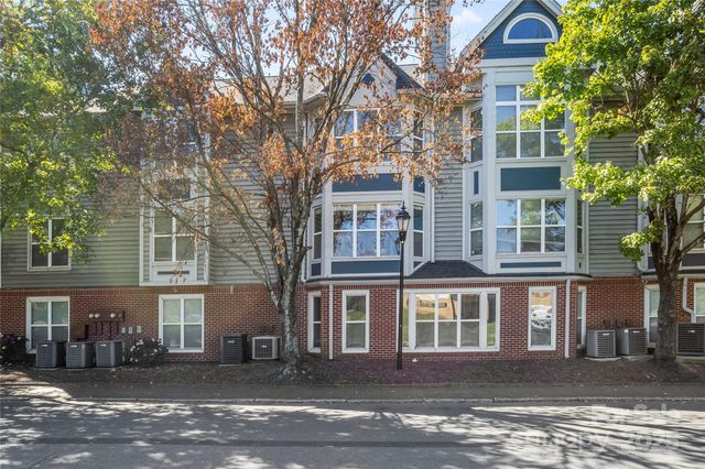 a front view of residential houses with yard