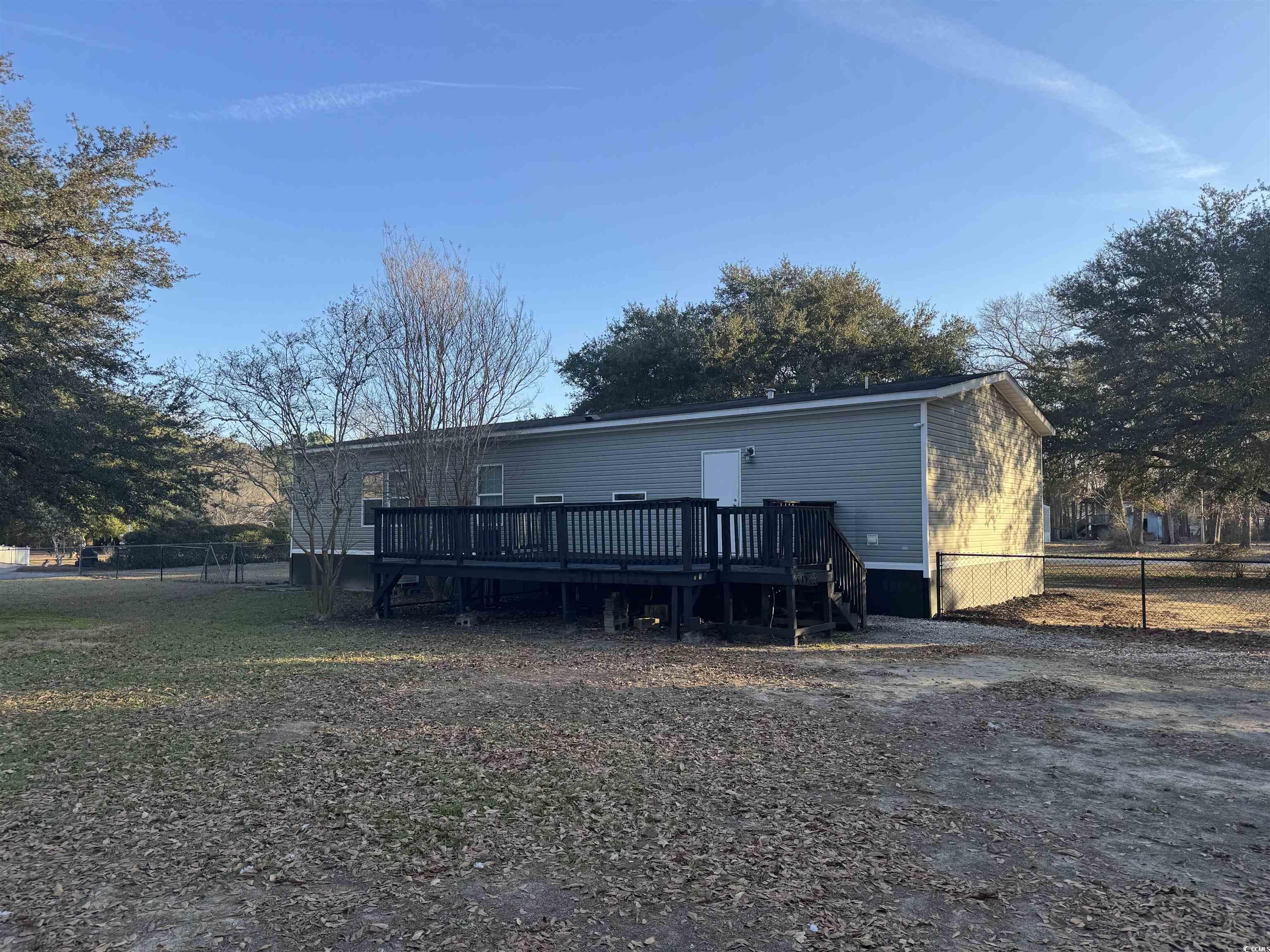 520 Deer Spring Loop Georgetown, SC 29440 - Photo 7 of 23 Rear view of house with a deck and stairway