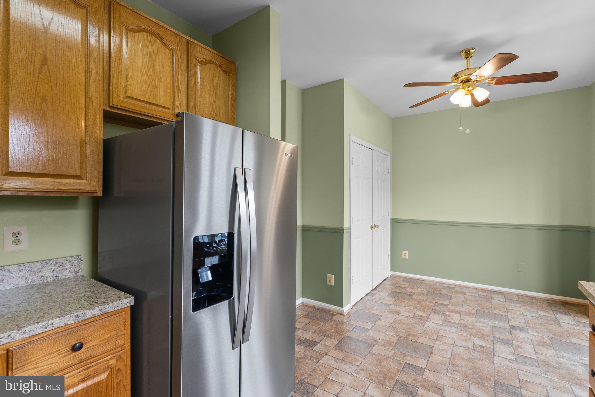 21937 Thompson Square Sterling, VA 20166 - Photo 19 of 48 a kitchen with stainless steel appliances granite countertop a refrigerator and a sink
