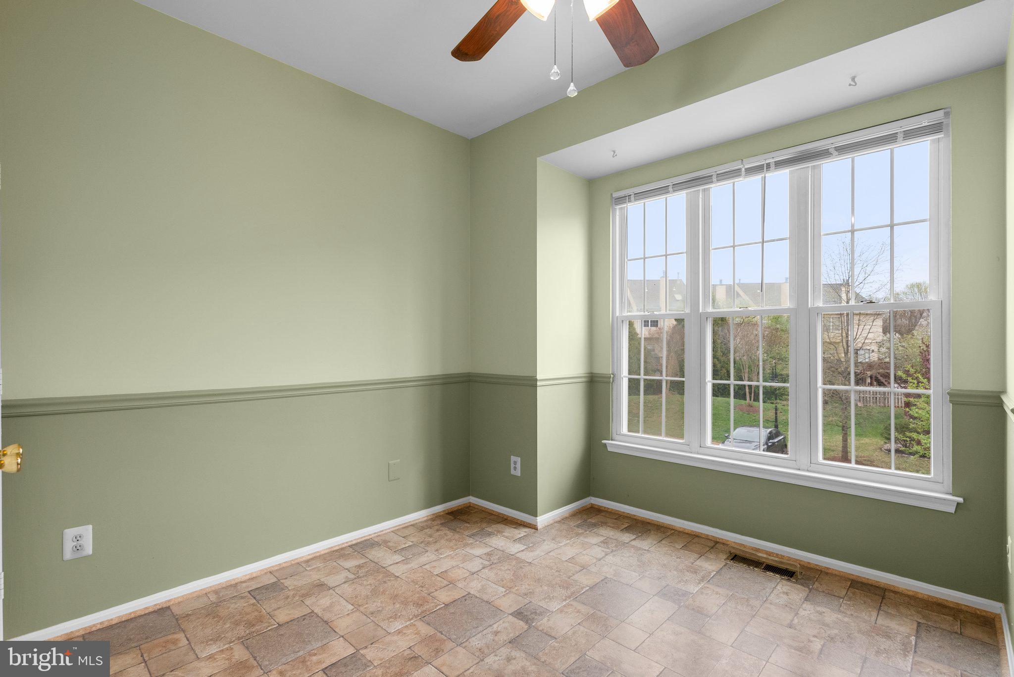21937 Thompson Square Sterling, VA 20166 - Photo 21 of 48 an empty room with chandelier fan and windows