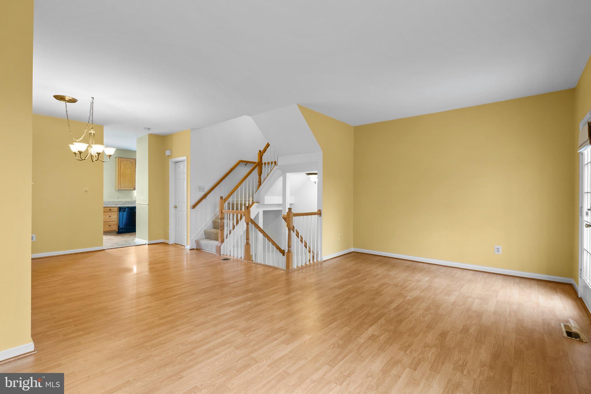 21937 Thompson Square Sterling, VA 20166 - Photo 26 of 48 a view of an empty room with wooden floor