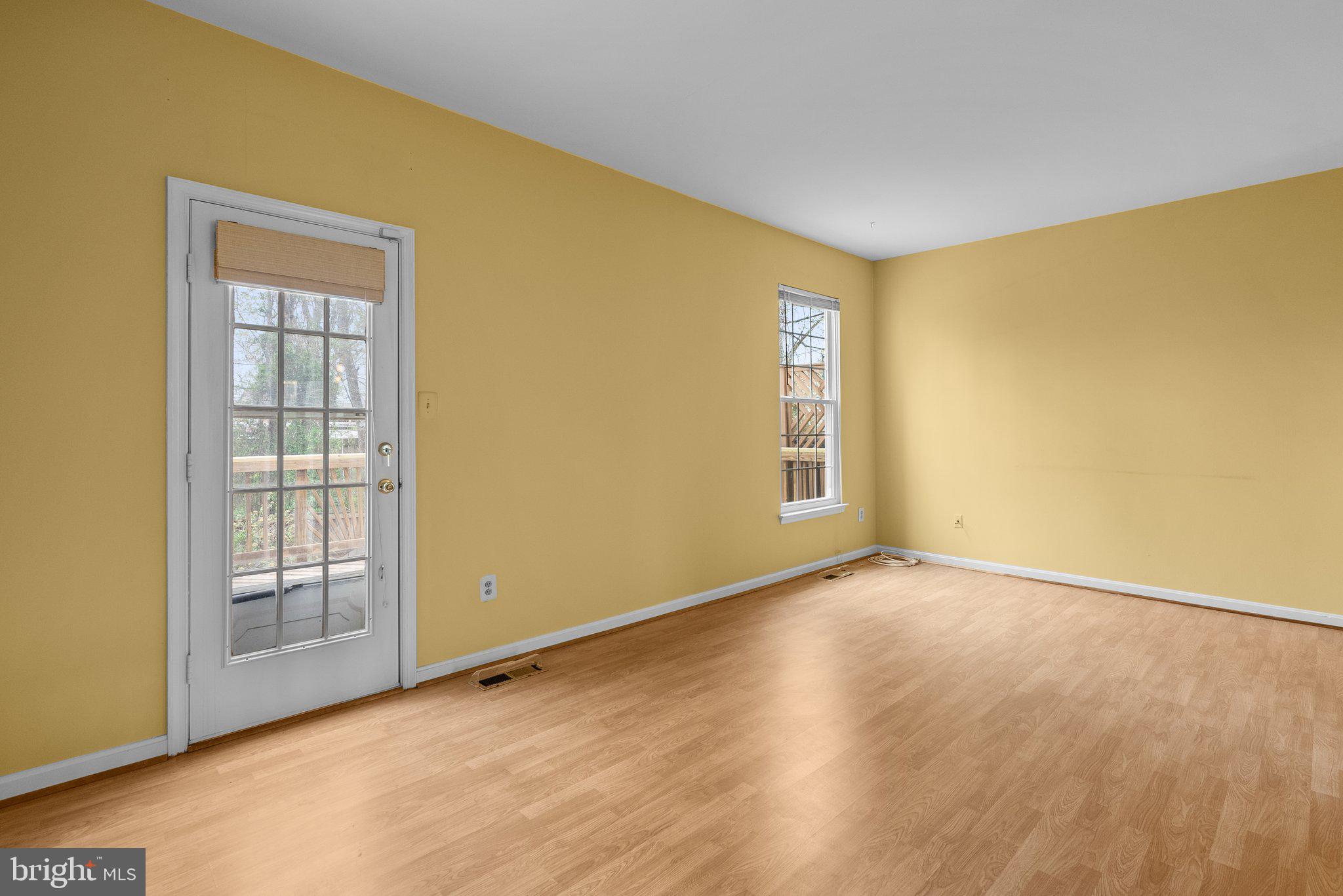 21937 Thompson Square Sterling, VA 20166 - Photo 28 of 48 an empty room with wooden floor and windows
