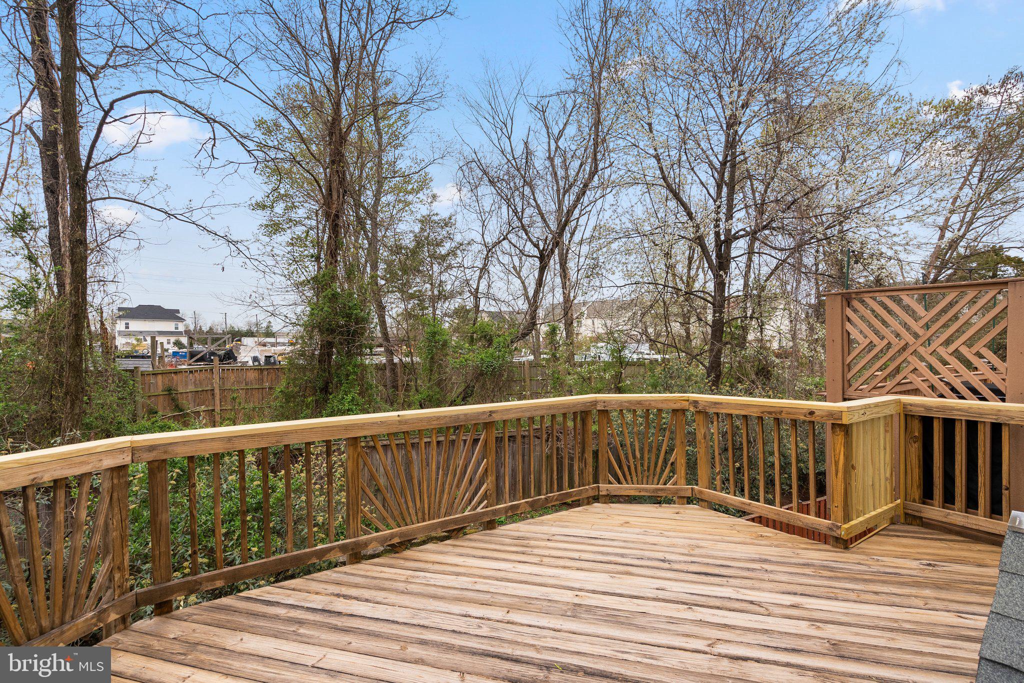 21937 Thompson Square Sterling, VA 20166 - Photo 31 of 48 a view of wooden deck and a trees