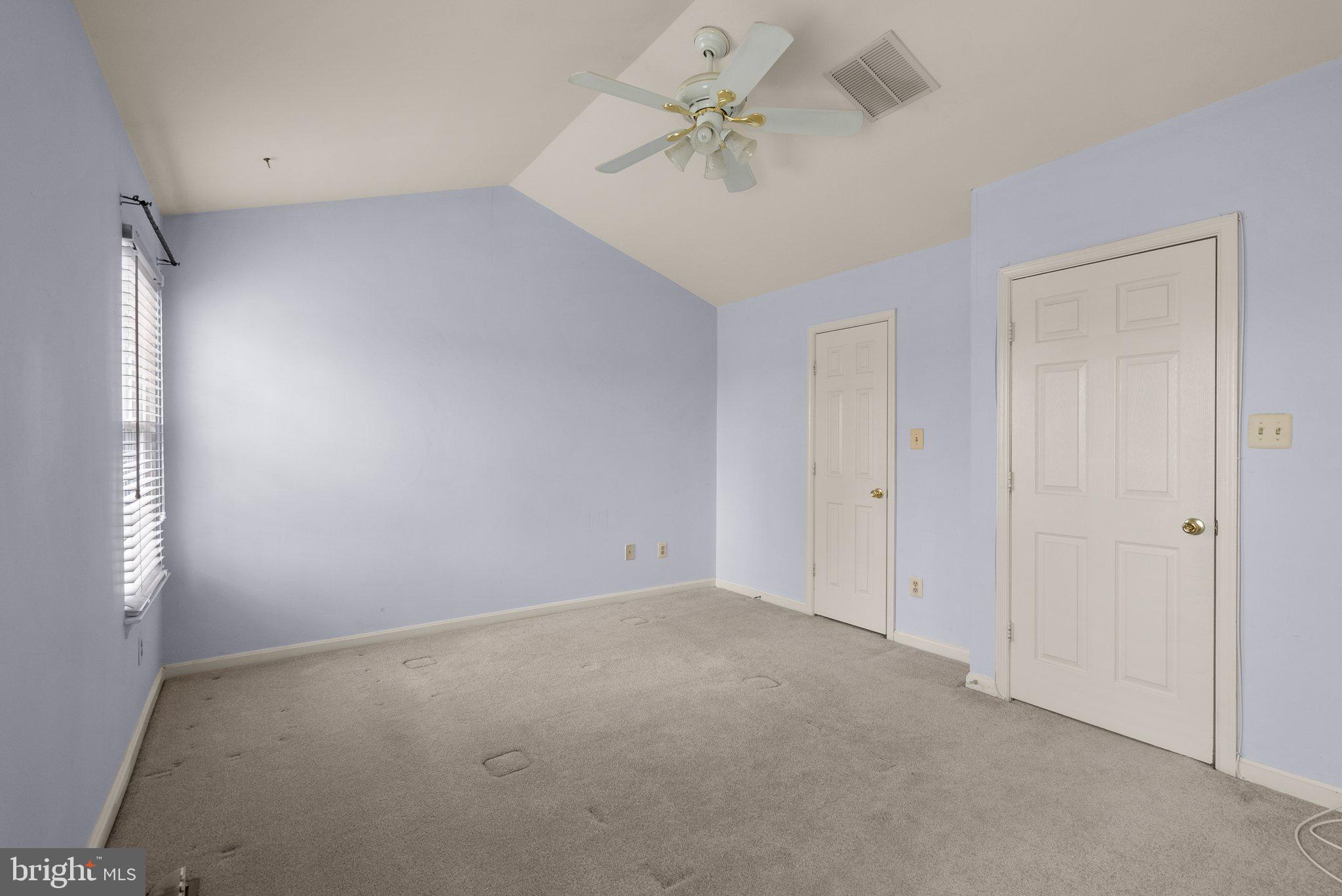 21937 Thompson Square Sterling, VA 20166 - Photo 33 of 48 a view of an empty room with a chandelier fan