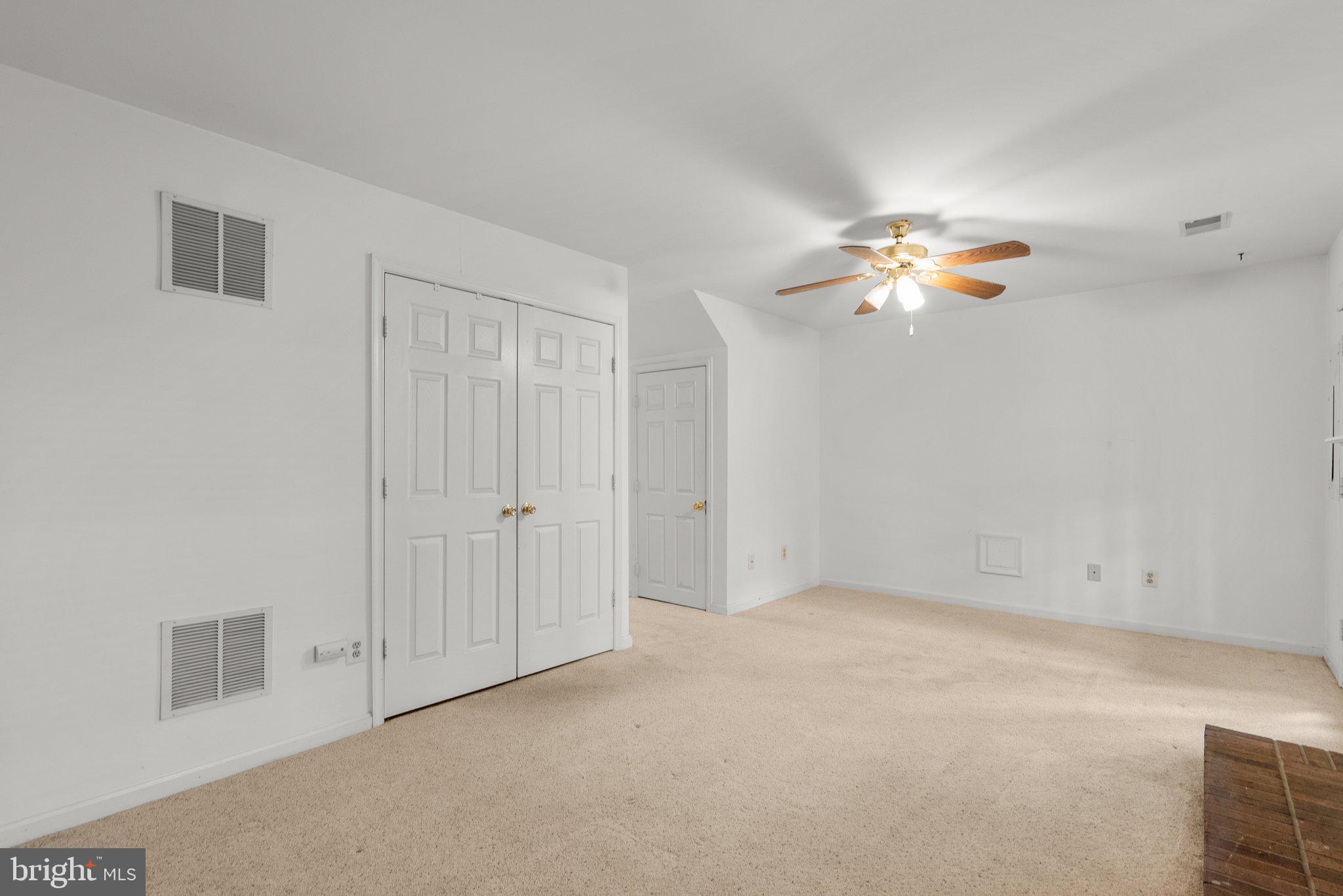 21937 Thompson Square Sterling, VA 20166 - Photo 8 of 48 an empty room with chandelier fan