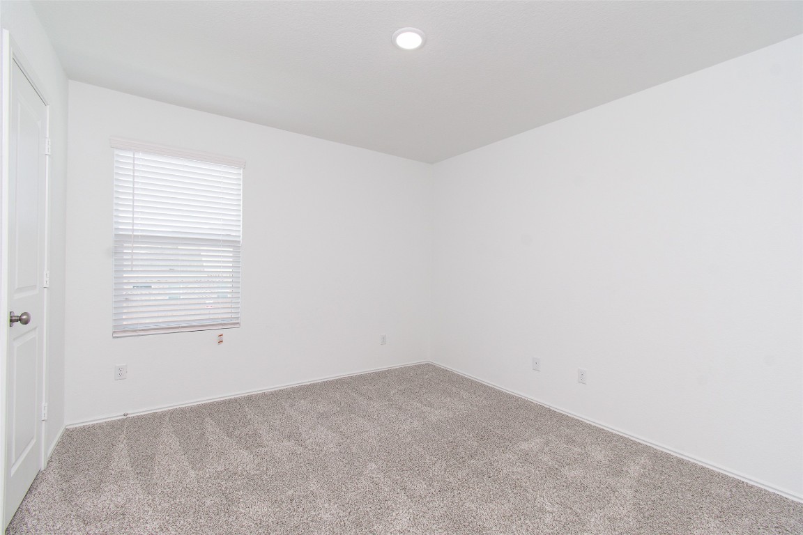 9101 Daisy Cutter Crossing Georgetown, TX 78626 - Photo 14 of 28 Unfurnished room with carpet flooring and recessed lighting