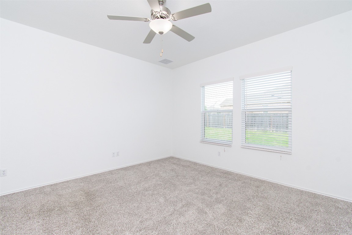 9101 Daisy Cutter Crossing Georgetown, TX 78626 - Photo 24 of 28 Unfurnished room featuring carpet floors and a ceiling fan