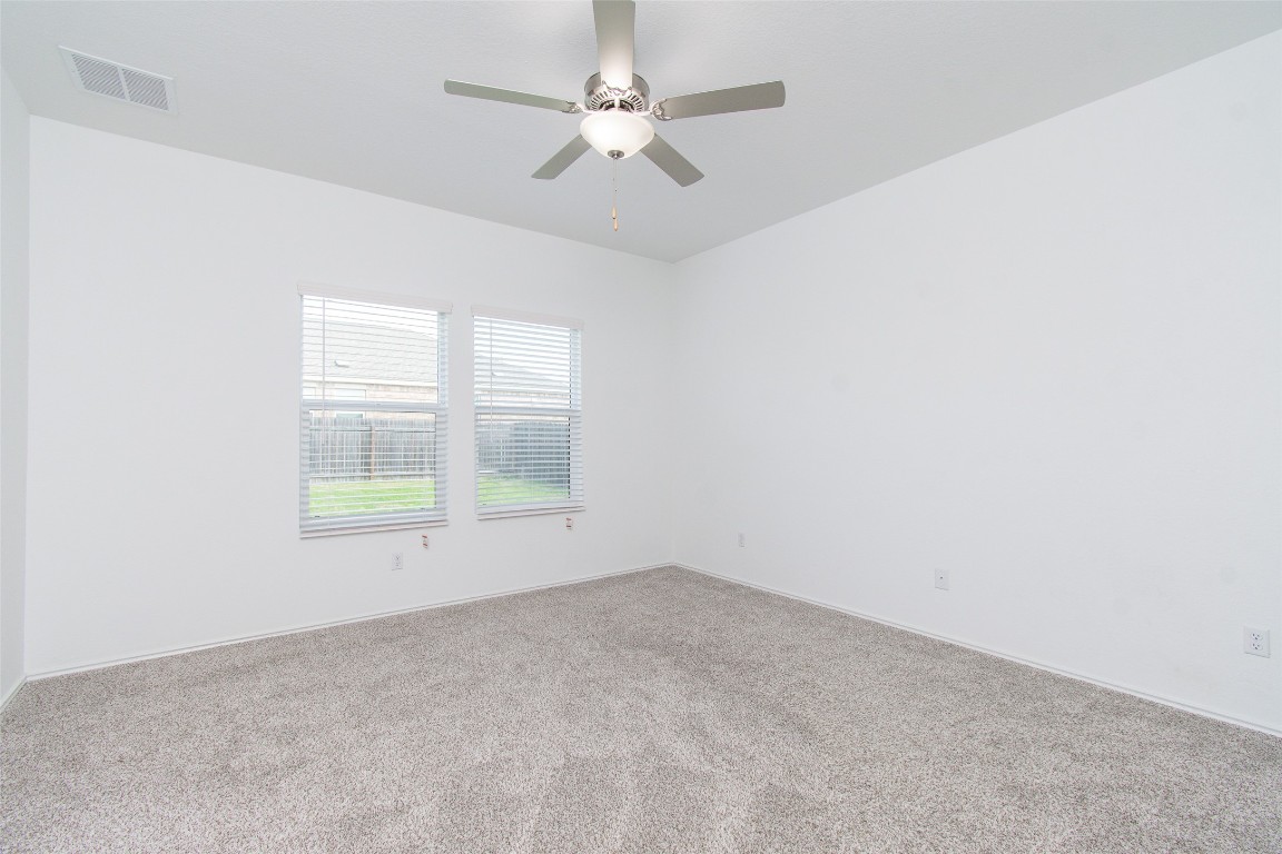 9101 Daisy Cutter Crossing Georgetown, TX 78626 - Photo 26 of 28 Unfurnished room featuring carpet flooring and a ceiling fan