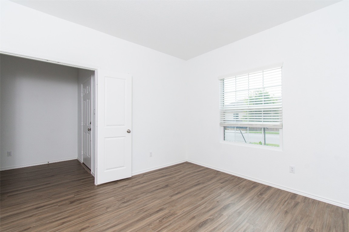 9101 Daisy Cutter Crossing Georgetown, TX 78626 - Photo 8 of 28 Spare room featuring wood finished floors and baseboards