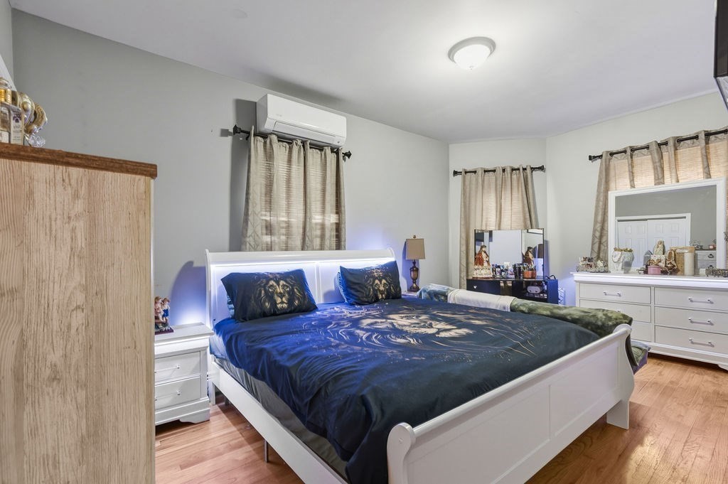 271 Mulberry Street Fall River, MA 02721 - Photo 11 of 30 a bedroom with a large bed and a window