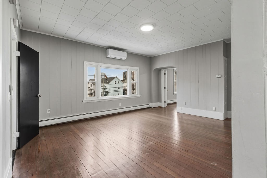 271 Mulberry Street Fall River, MA 02721 - Photo 23 of 30 an empty room with wooden floor and window