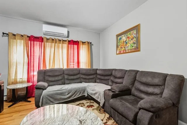 a kitchen with stainless steel appliances granite countertop a stove top oven a sink dishwasher and cabinets with wooden floor