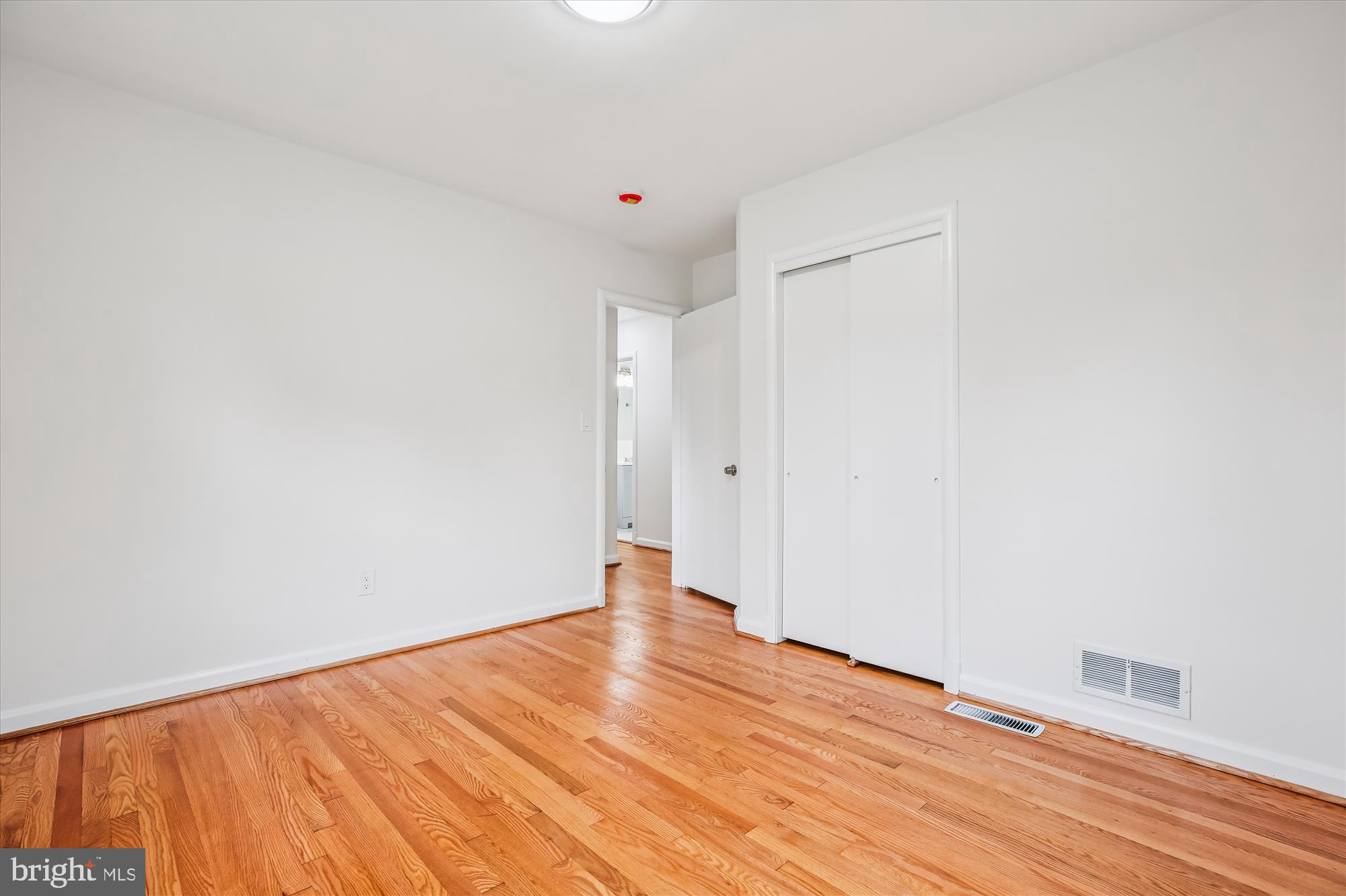 11502 Nairn Road Silver Spring, MD 20902 - Photo 21 of 43 a view of an empty room with wooden floor