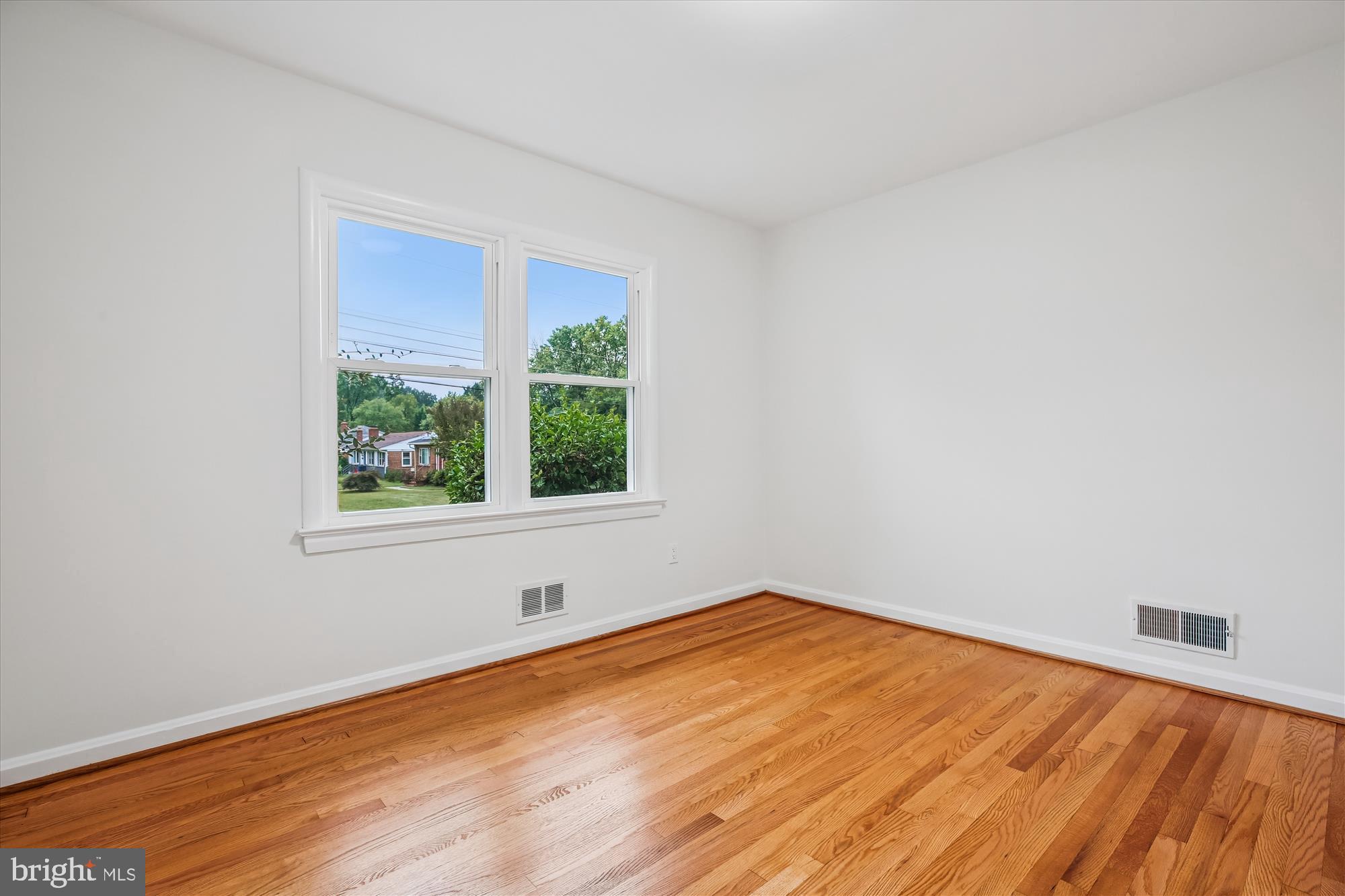 11502 Nairn Road Silver Spring, MD 20902 - Photo 23 of 43 a view of empty room with wooden floor and fan