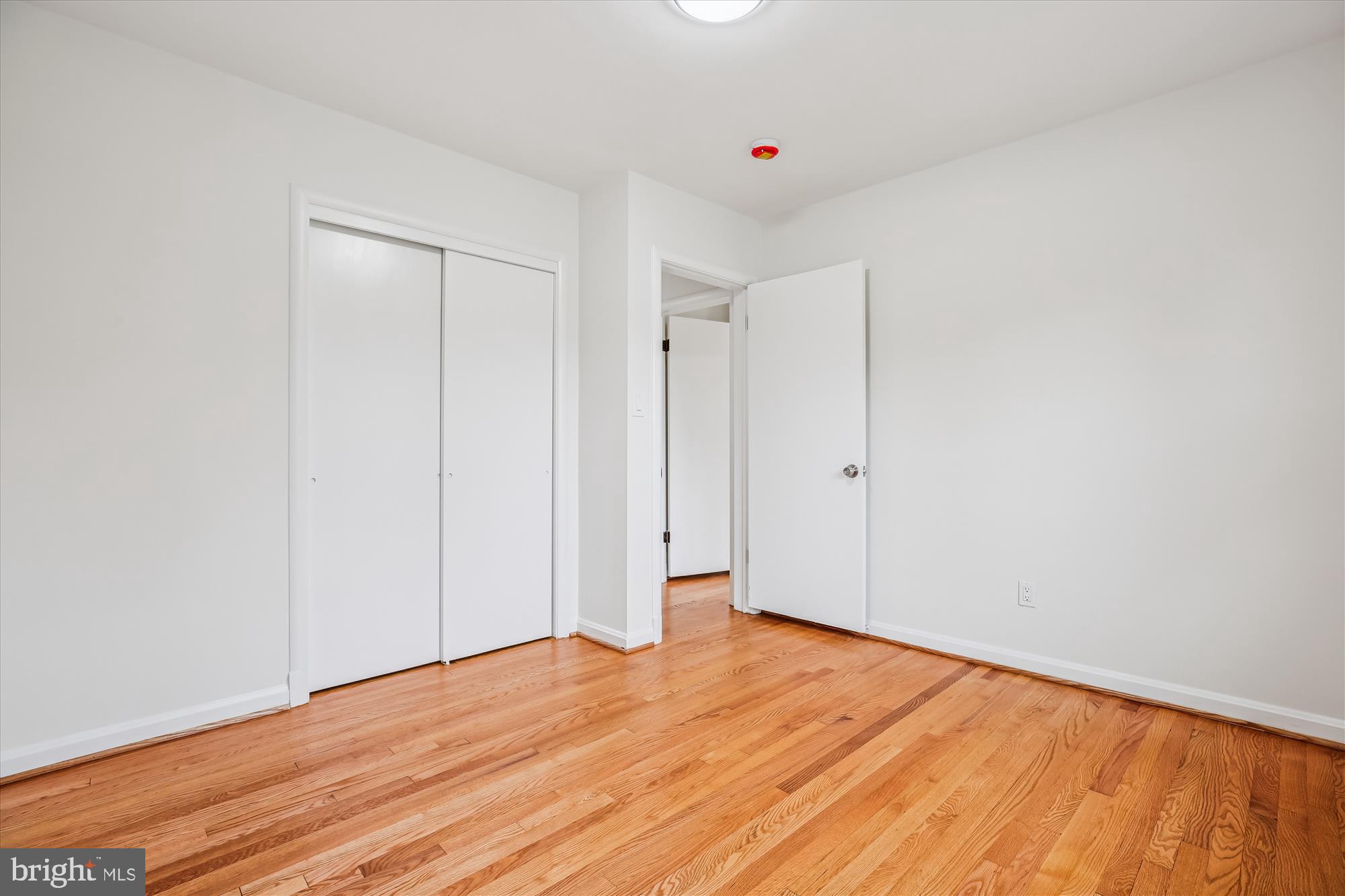 11502 Nairn Road Silver Spring, MD 20902 - Photo 24 of 43 a view of an empty room with wooden floor