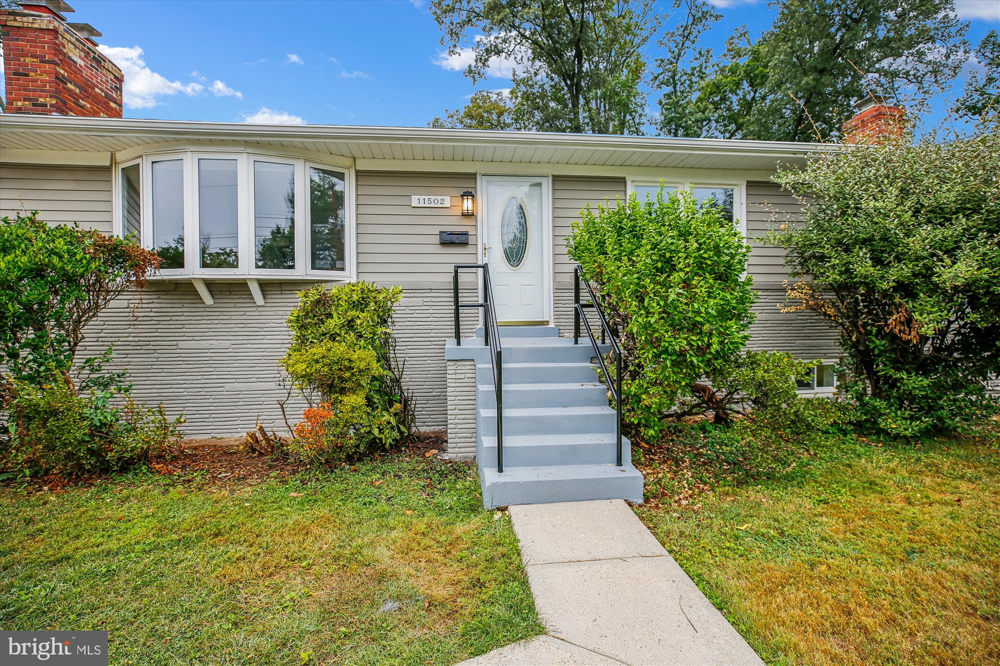 11502 Nairn Road Silver Spring, MD 20902 - Photo 35 of 43 front view of a house with a yard