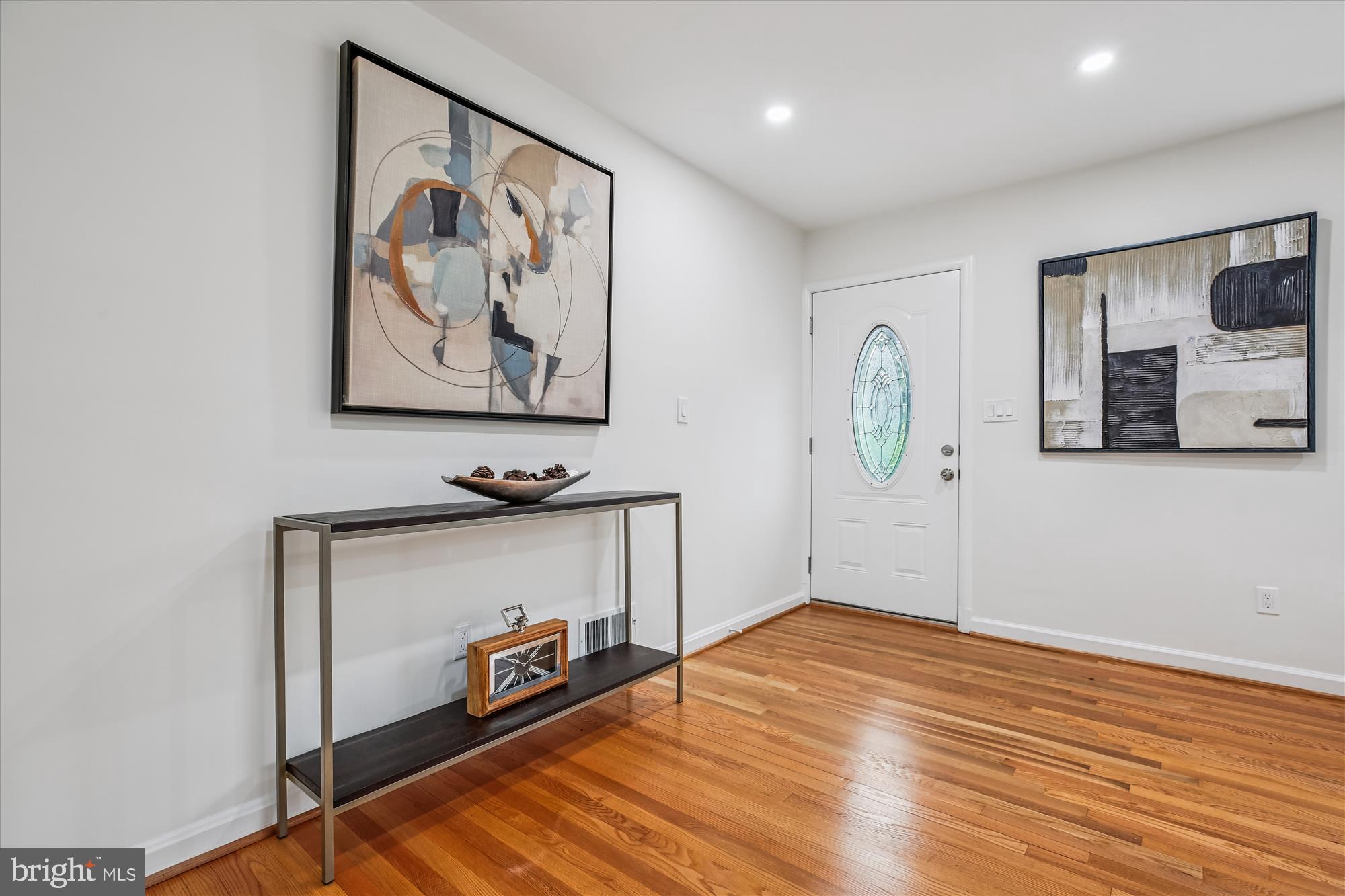 11502 Nairn Road Silver Spring, MD 20902 - Photo 5 of 43 a view of a hallway with wooden floor and entryway