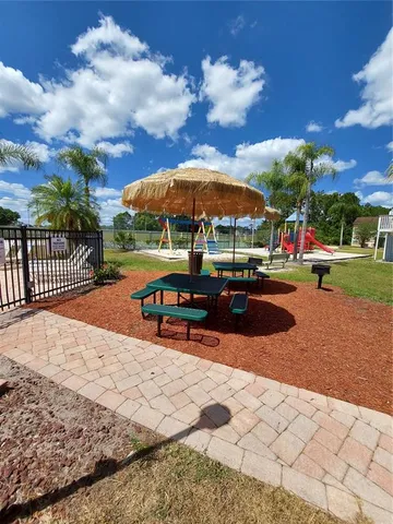 a view of outdoor space with playground and green space