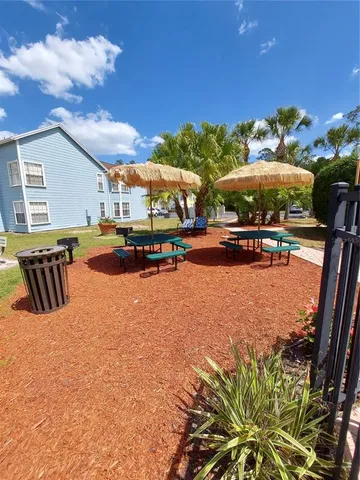 a view of outdoor space with playground and green space