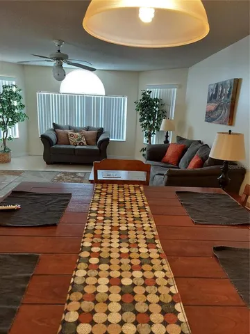 a living room with a rug and a rug