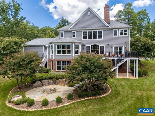 a house with trees in the background