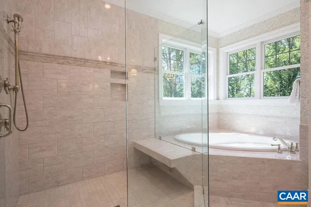 a bedroom with a large bed and a couch