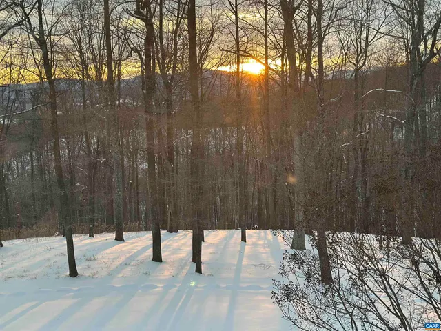 an aerial view of a house with mountain view