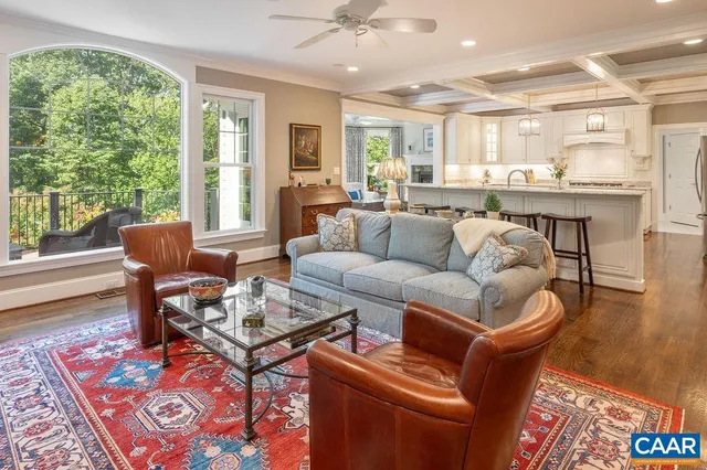 a living room with fireplace furniture and a flat screen tv