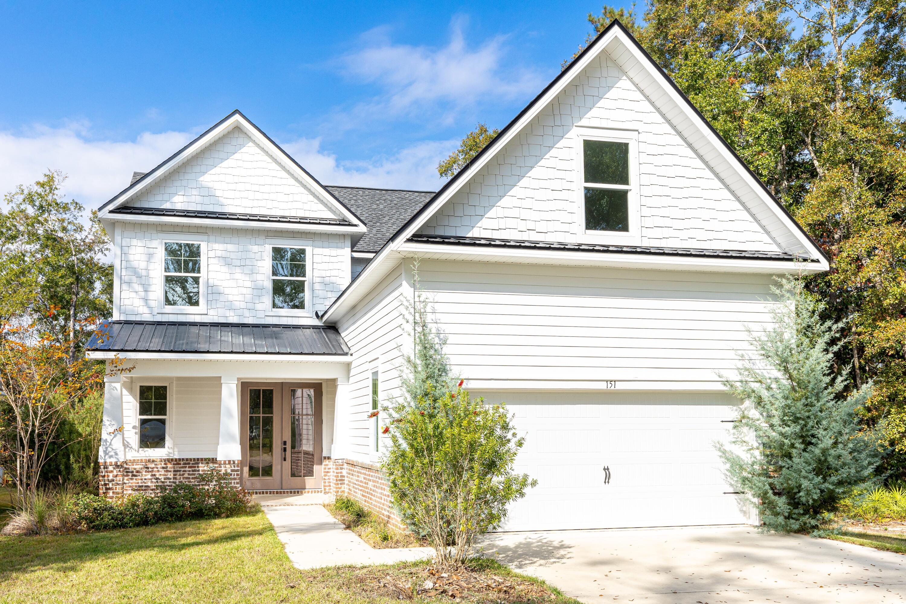 151 Redfish Pt Drive Freeport, FL 32439 - Photo 2 of 40 a view of a house with a yard