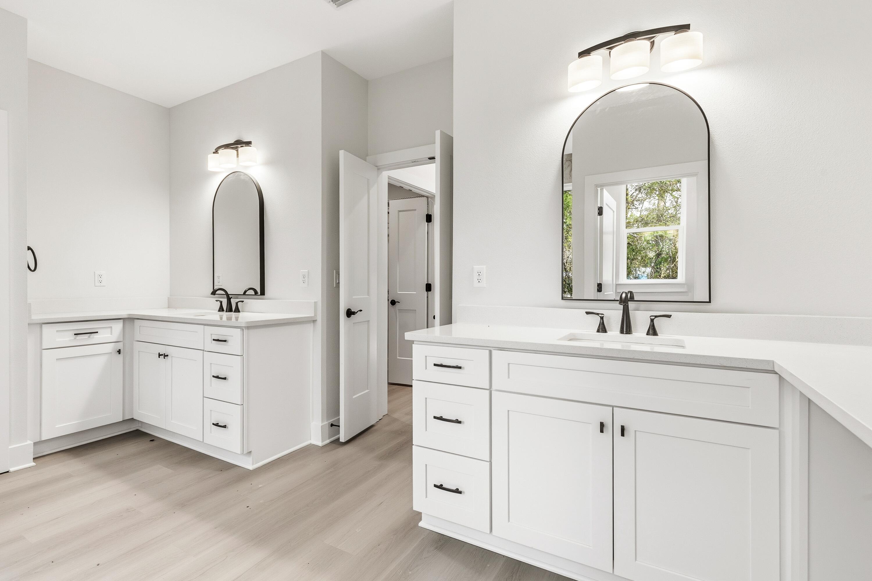 151 Redfish Pt Drive Freeport, FL 32439 - Photo 21 of 40 a bathroom with a double vanity sink mirror and a window
