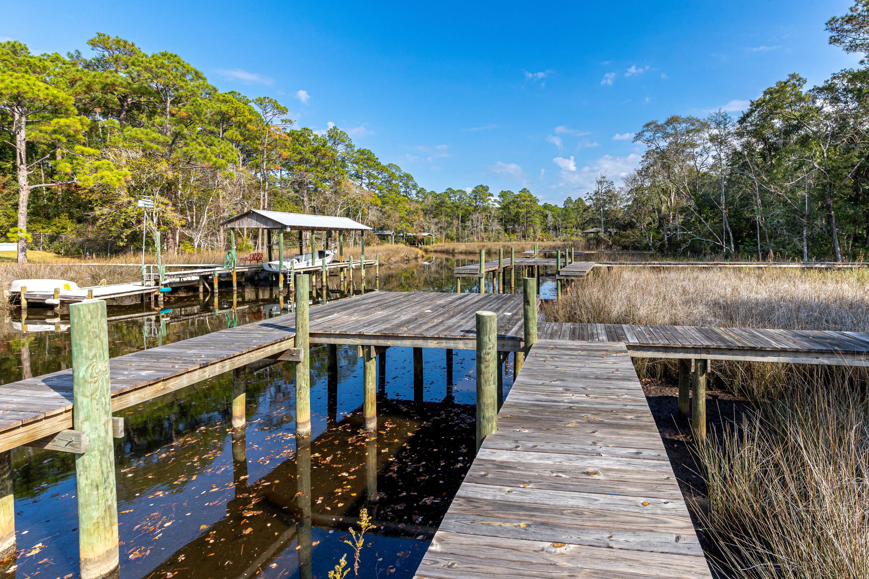 151 Redfish Pt Drive Freeport, FL 32439 - Photo 27 of 40 a balcony with wooden floor and lake view