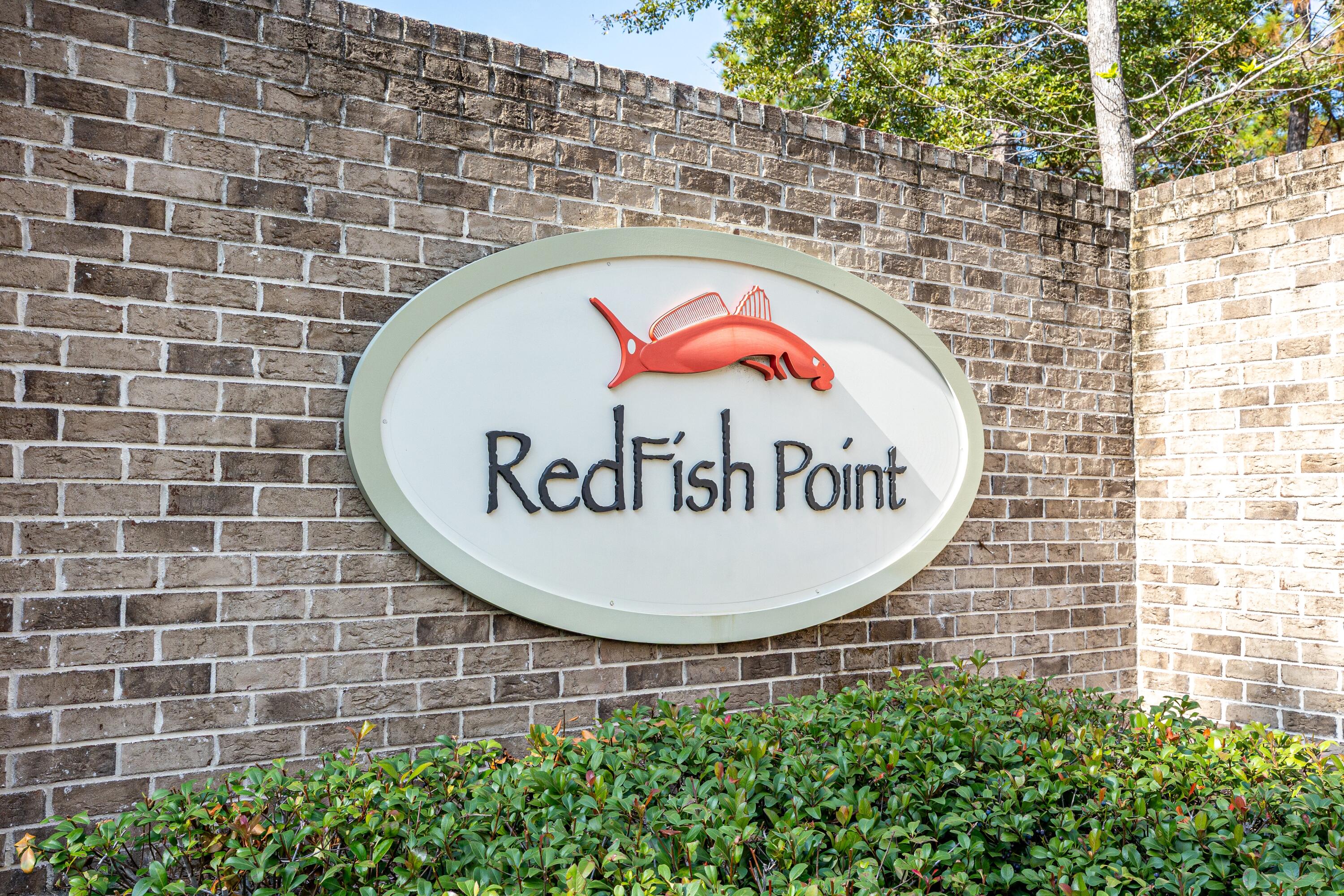 151 Redfish Pt Drive Freeport, FL 32439 - Photo 39 of 40 a view of a brick wall with a sign on it