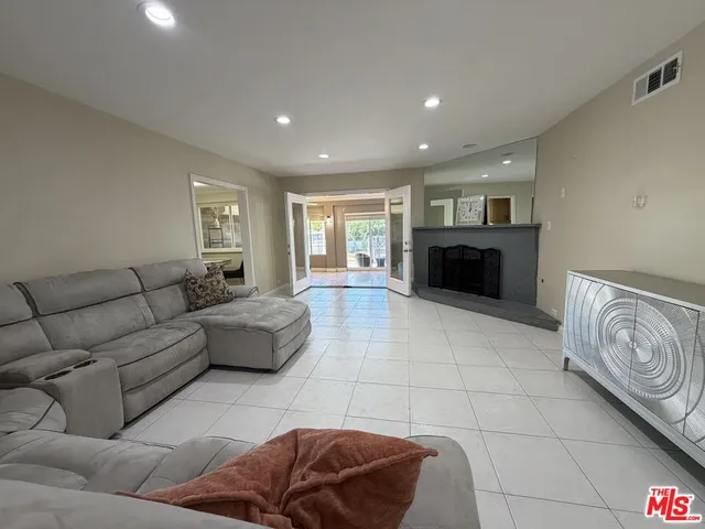 a living room with furniture and a couch