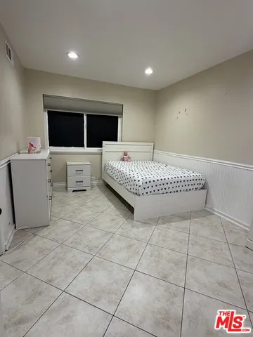 a living room with a couch and a flat screen tv